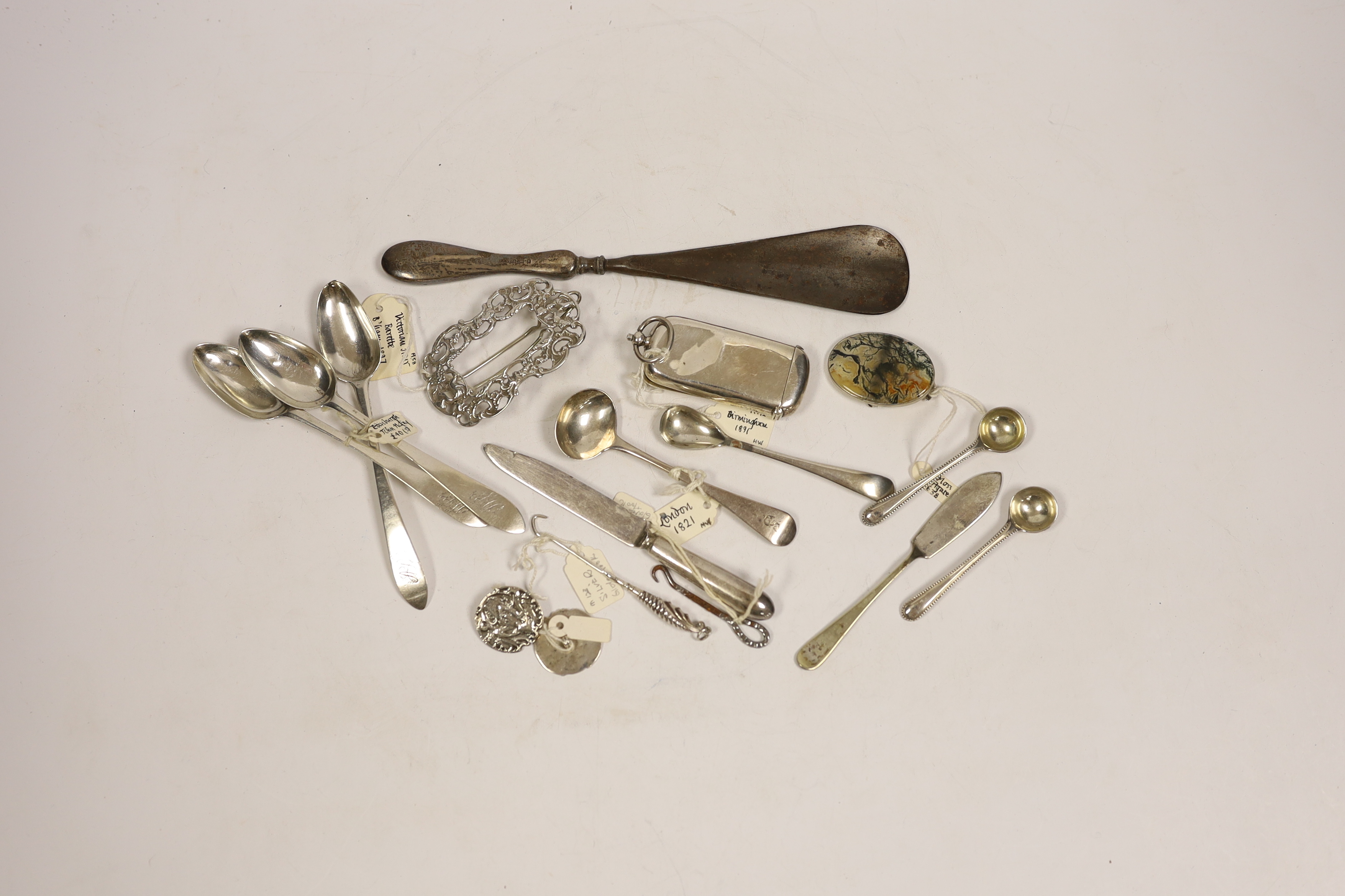 An Edwardian silver combination vesta and sovereign case (a.f.), seven small items of silver flatware, a pair of silver buttons and a silver clip, together with five other items including button hooks, a moss agate brooc